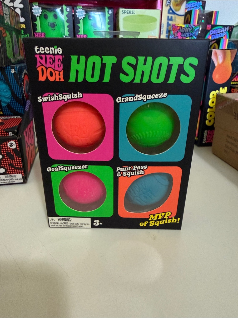 Teenie NeeDoh Hot Shots Squish Ball Set - Pink, Green, Orange, Blue